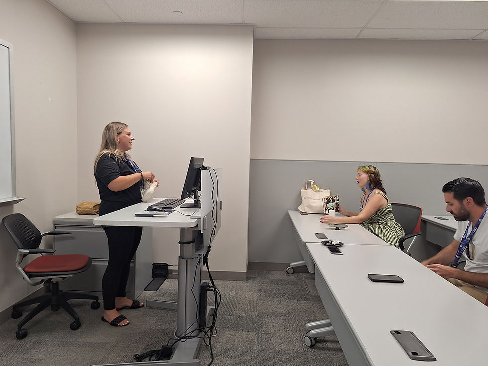 Wendy Robicheau engages with a high school CTE educator on applications of AI in Manufacturing.