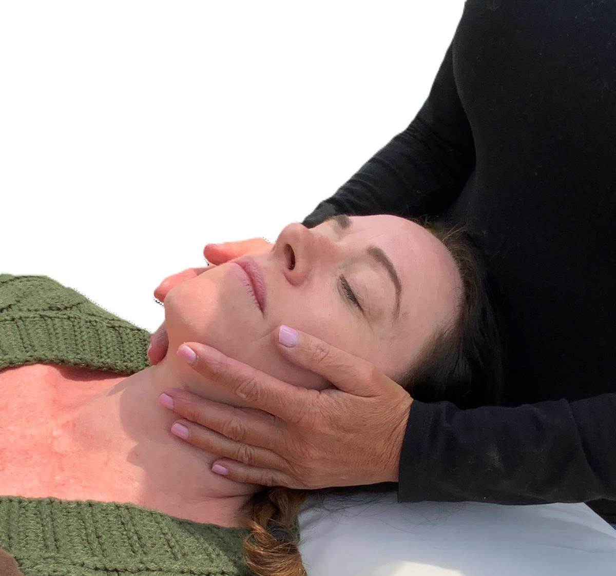 Image of someone receiving a Reiki treatment