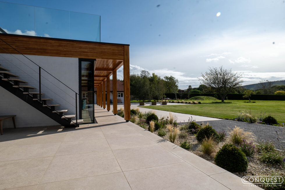 a staircase leading up to a building with a glass railing