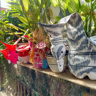 Fun pots for plants made out of old plastic bottles in Bali