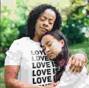 Woman embracing young girl