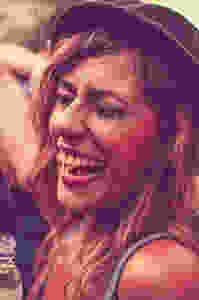 woman in a hat laughing