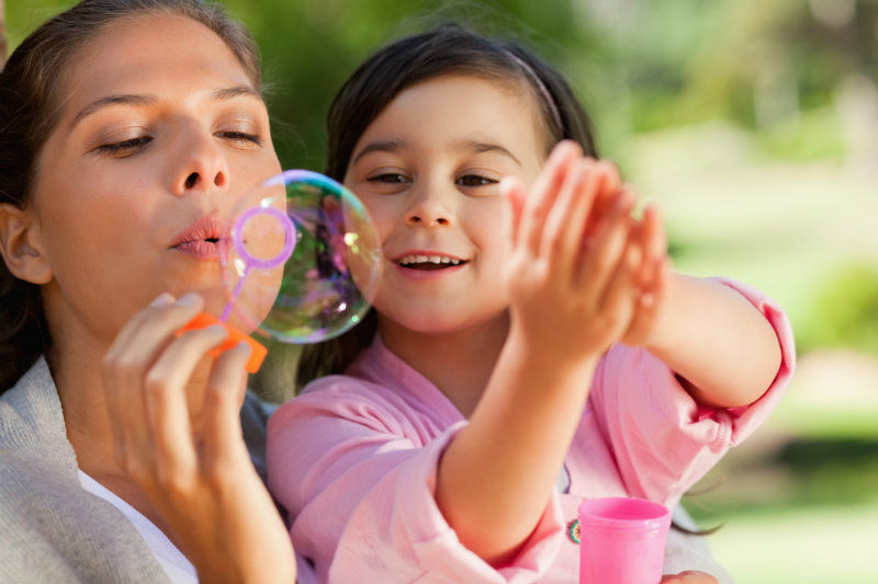 mother-teacher-therapist-blowing-bubbles.jpeg