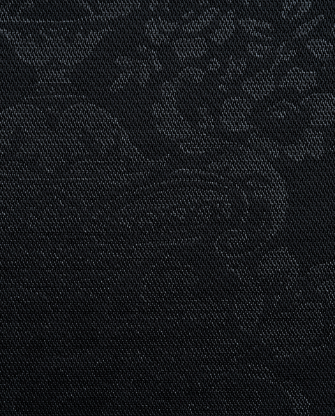 The black print tuxedo fabric close up shot.