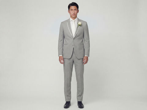 Single Breasted 2 button Light Grey Tuxedo jacket ghost shot against a light grey background.