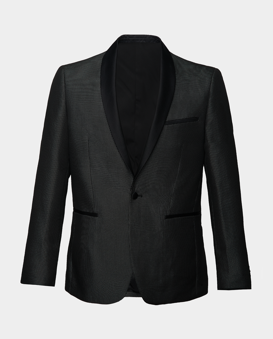 A grey pin dot tuxedo jacket with shawl black satin lapels ghost shot on a light grey background.
