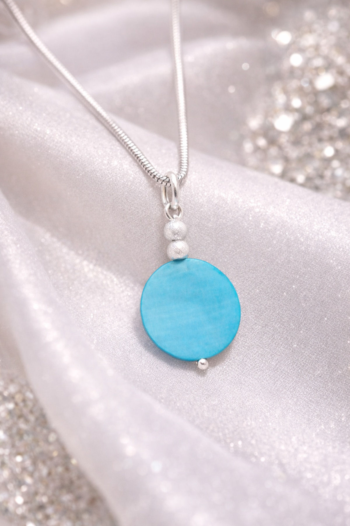 Blue Shell Pendant P102 on a luxury background.