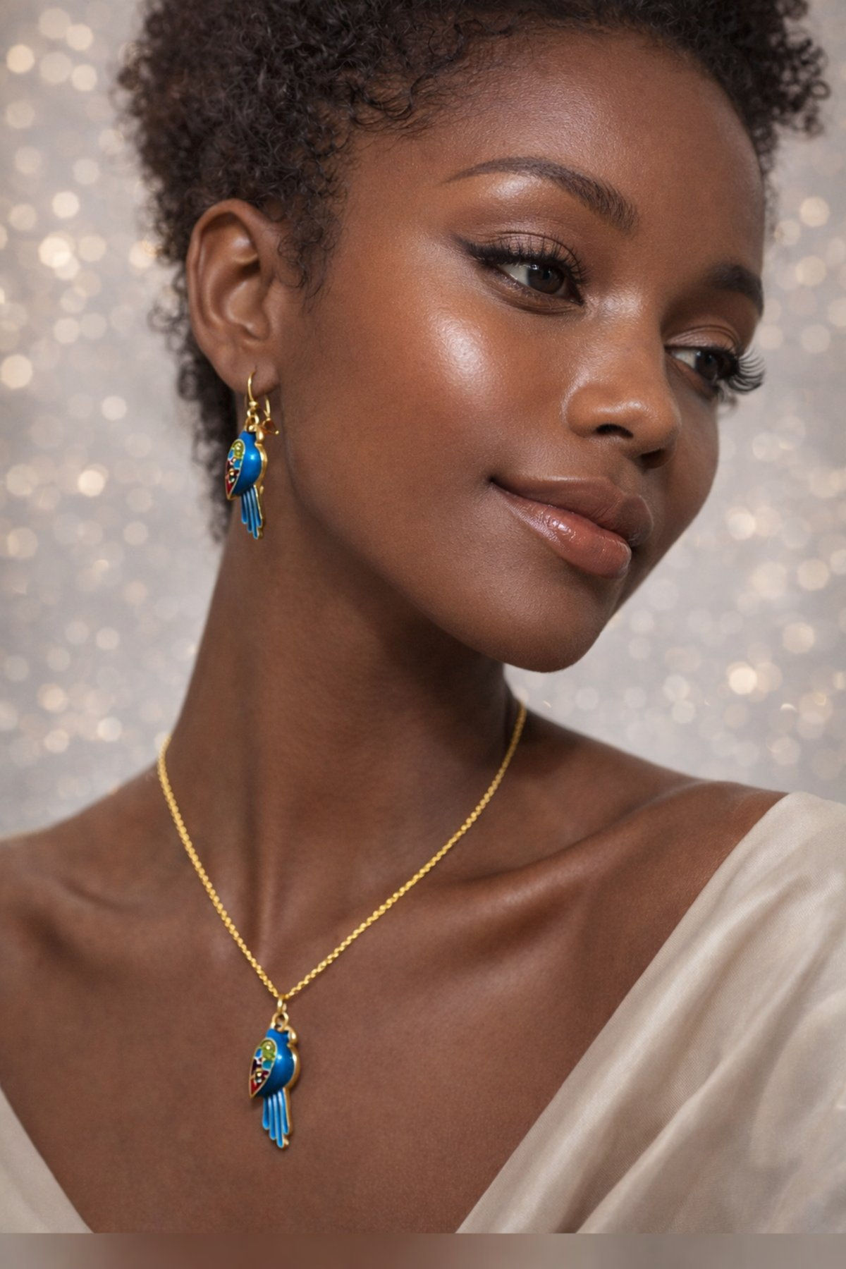 Parrot Pendant And Earring Set S13 worn on a model.