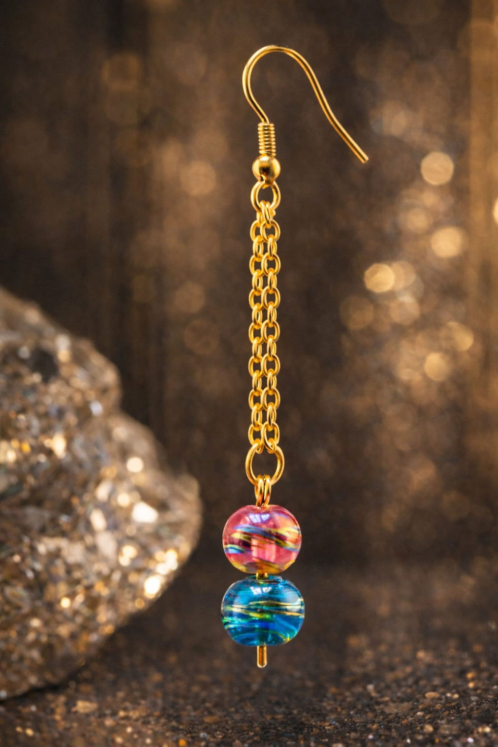 Pink And Blue Beaded Earrings E15 on a luxury background.