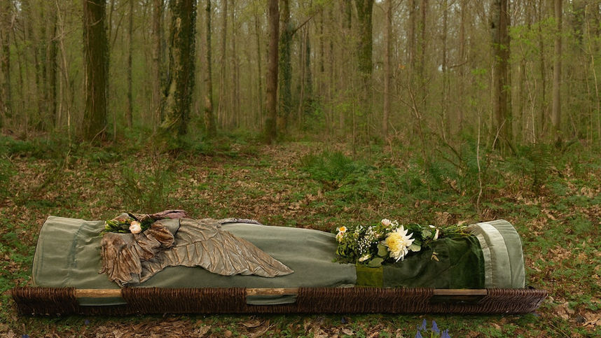 Sage Wings artisan burial shroud in sage green with handcrafted textile wings for natural burial or cremation.