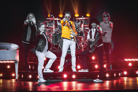 ABSOLUTE BANDS performs, singer dressed as Freddie Mercury