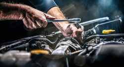 auto-mechanic-working-in-garage-repair-service-400-231379243