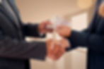 businessmen-with-bills_edited.jpg