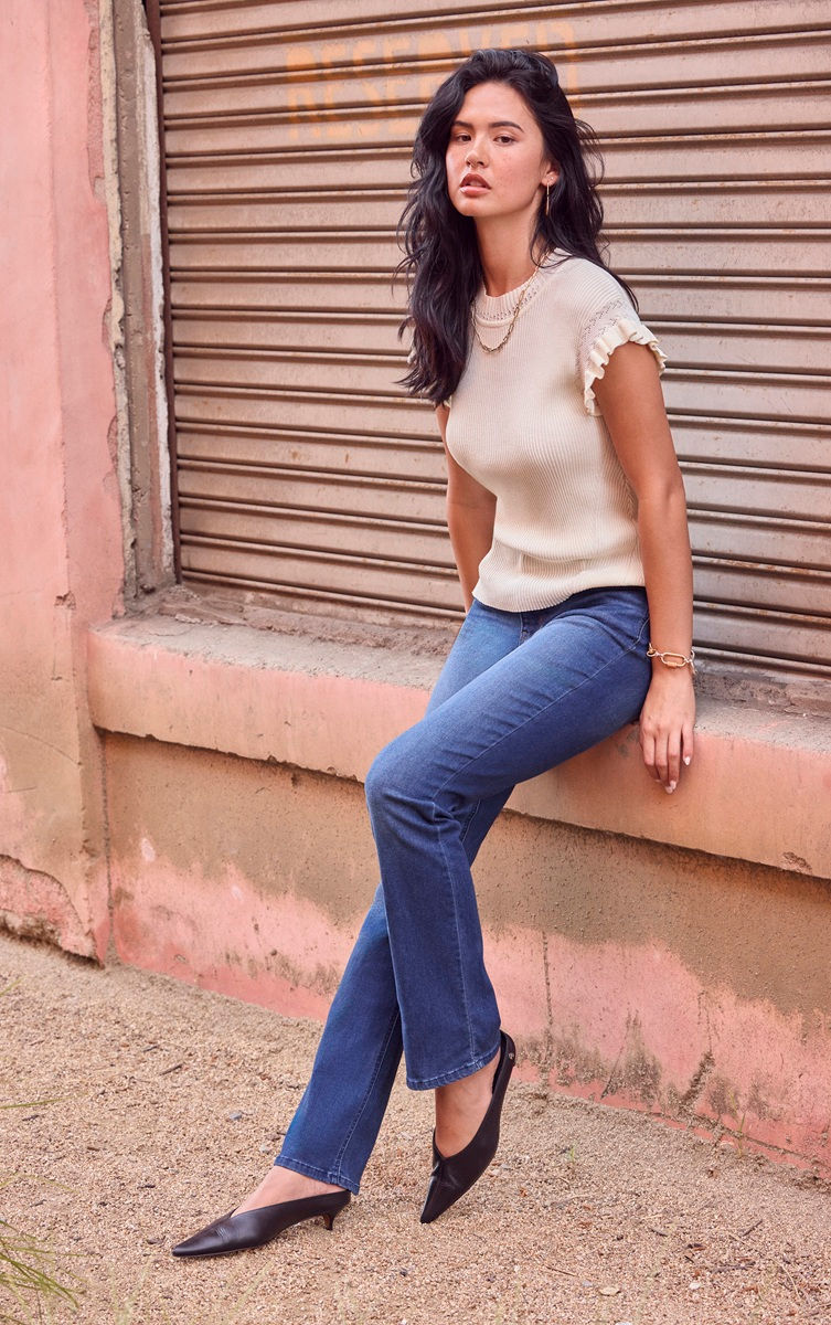 Woman wearing slim straight Wit & Wisdom jeans styled with a casual top for a flattering everyday look