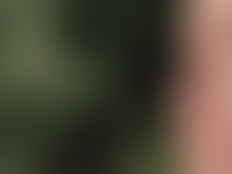 Stephanie Edward is a white woman. Her eyes are closed and the sun is shining on her face.