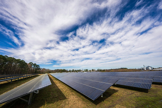 A large solar farm installed in the middle of a field.