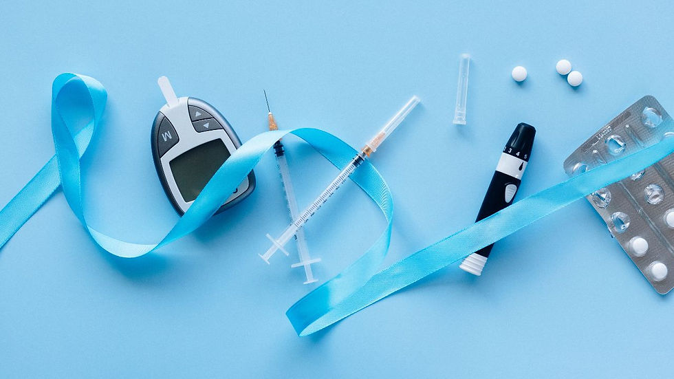 Diabetes tools on blue background: glucose meter, insulin pen, syringes, pills, blister pack, and light blue ribbon.