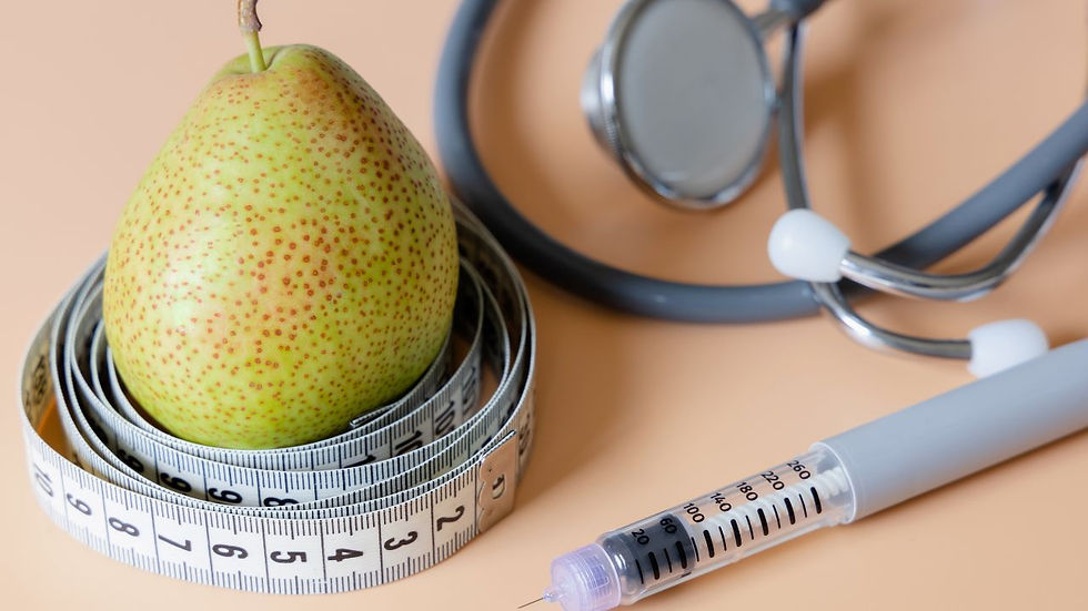 Pear with measuring tape, stethoscope, and syringe on a peach background. Themes of health, measurement, and medical care.