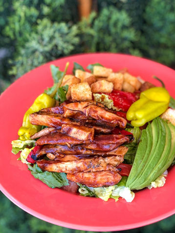 Grilled chicken salad with avocado, peppers, and croutons