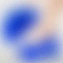 White peep-toe platform Mary Jane pumps with a fretwork design, super high spike heels, and a platform sole.