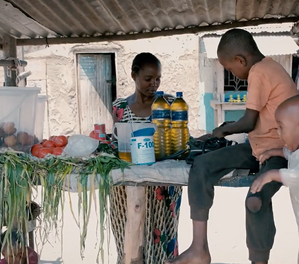 Microcredit recipient woman at her stall