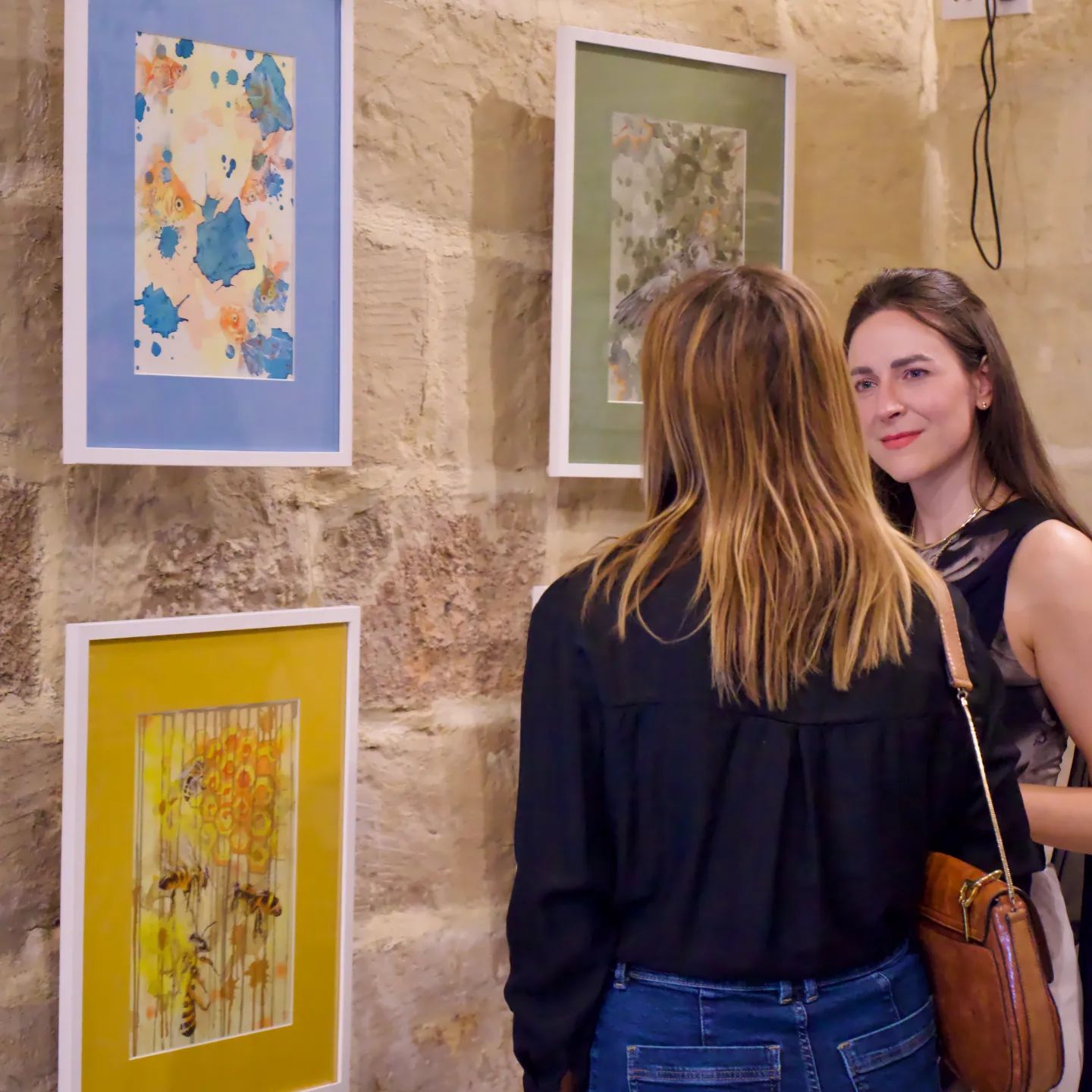 Talking with the artist in front of the artwork