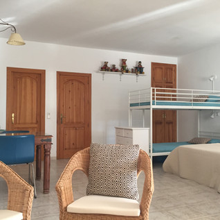 3 - THE STUDIO. A bed 180 cm wide, sofa bed and a trunk bed makes this the perfect space for two to four adults with two to four children.