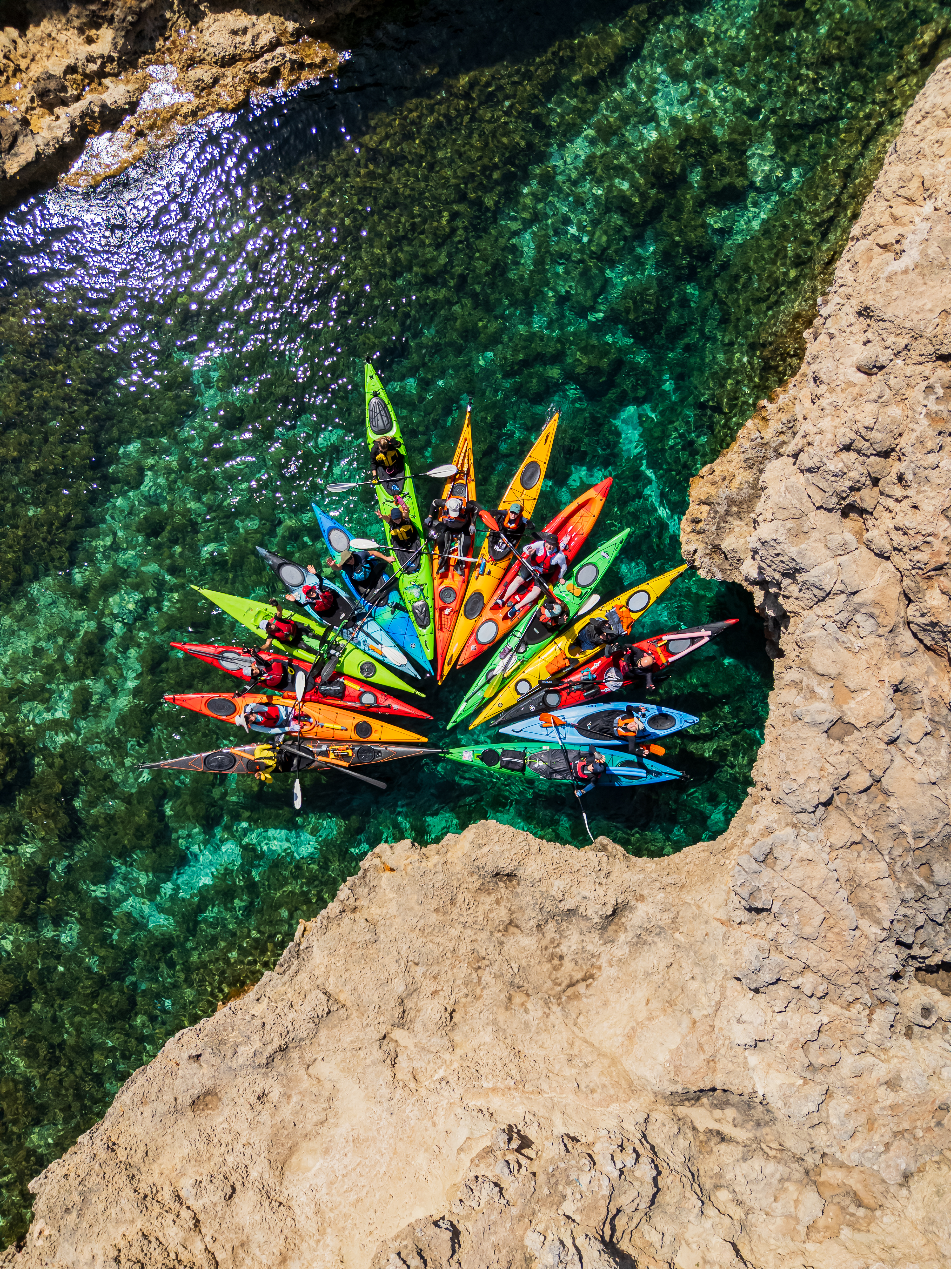 Sea kayakers exploring Malta’s dramatic coastline with Get Out and Kayak Malta