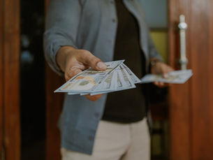 giving cash to a person bringing items in to resale store