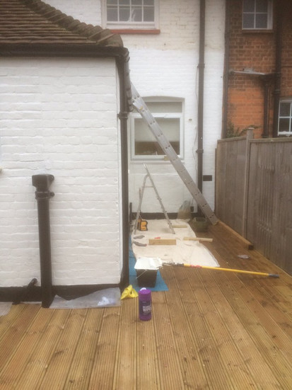 painters equipment on the decking ahead of painting in tottenham