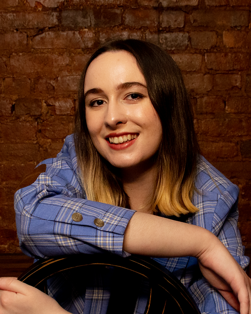 saunderheadshotsmiling.png
