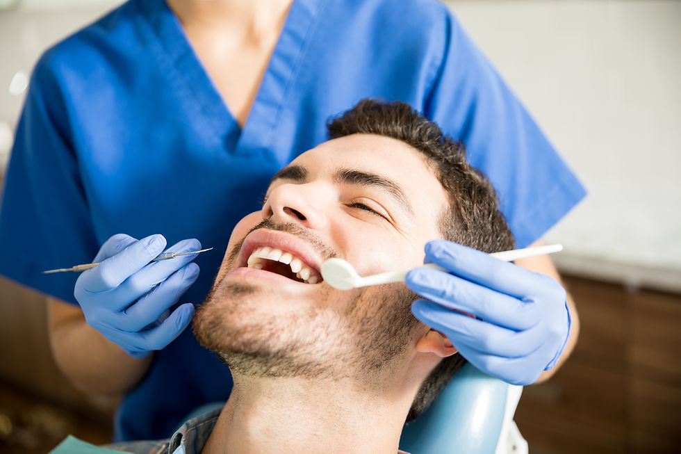 mid-adult-patient-receiving-dental-treatment-with-tools-from-female-dentist-clinic.jpg