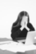 woman covering her face with her hands
