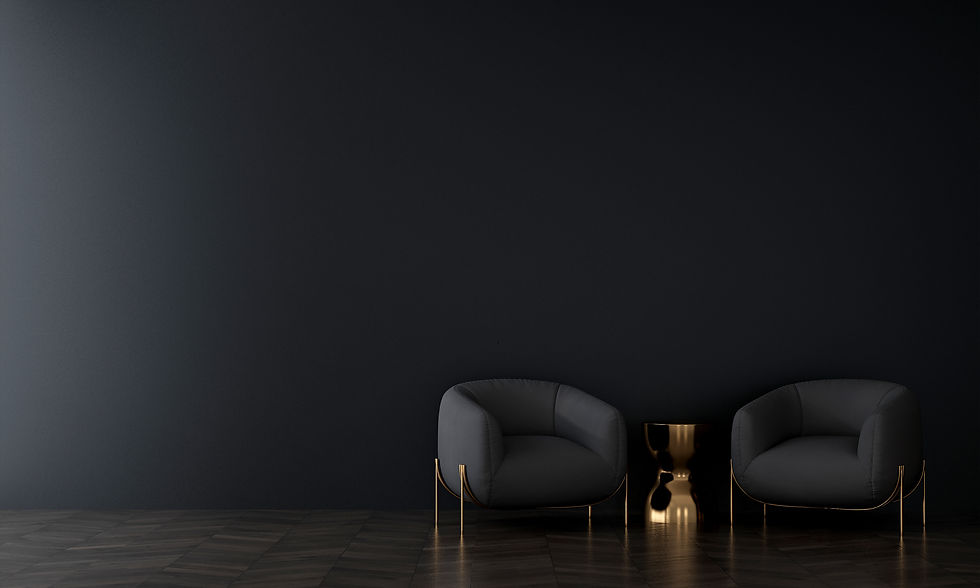 dark-room-with-gold-table-two-grey-armchairs-front-black-wall.jpg