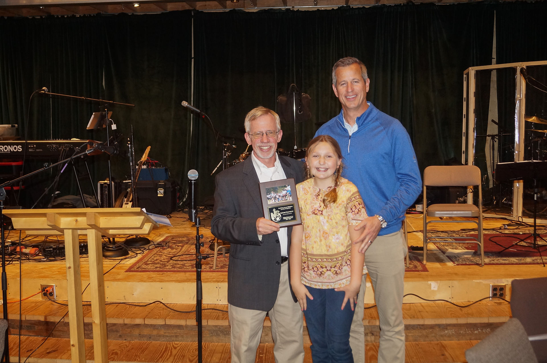 Jeff Martin receiving thank you plaque for Ingram Equipment Company serving as a Uniform Sponsor!