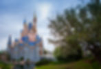Magic Kingdom Castle from side view over water with no people in the photo on a sunny day