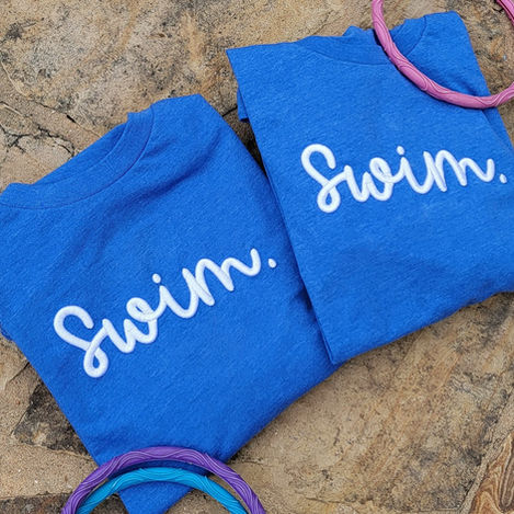 3D Puff Embroidered Shirt that says "Swim." in white thread.