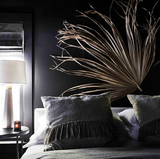 elegant bedroom with a dark wall.