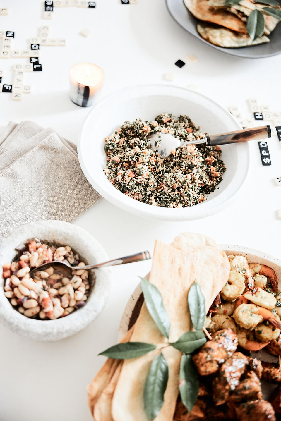 serving table with bowls of grains and beans.