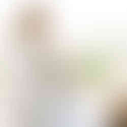 Elegant woman wrapped in a knitted shawl.