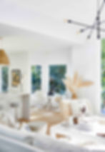 Light-flooded open-floor plan living area.