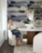 Beautiful woman seated at modern dining table.