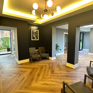 LVT in a herringbone design in a dental reception and waiting area
