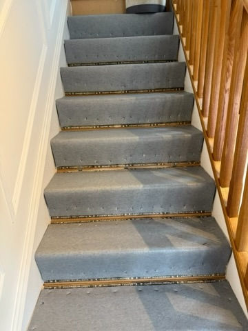 Stairs prepped with underlay for the installation of a full width stair runner