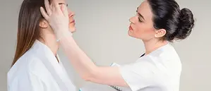 professional-cosmetician-examining-face-skin-600nw-2420573729.webp