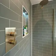 green tile gold shower fittings