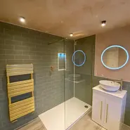 green tile gold fittings bathroom