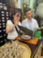 Dr. Hailey Pham, working hard with traditional herbs in an herbal pharmacy in Vietnam.
