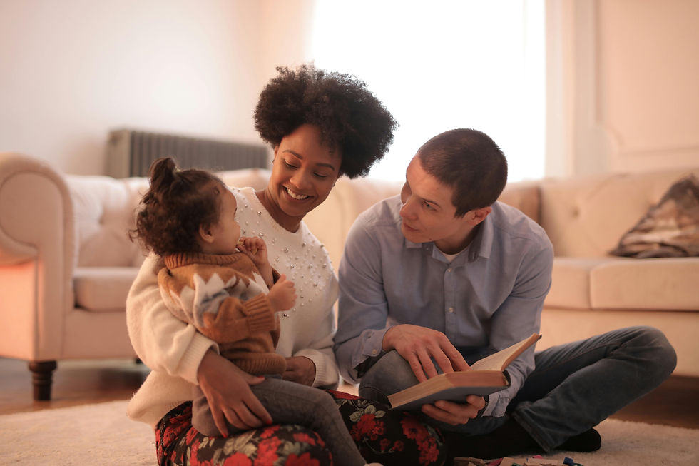 family reading with toddler representing healthy balance between care for others and self