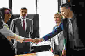 man and woman shaking hands